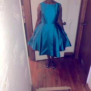 Color turquoise, size 14; bust 39, waist 39.